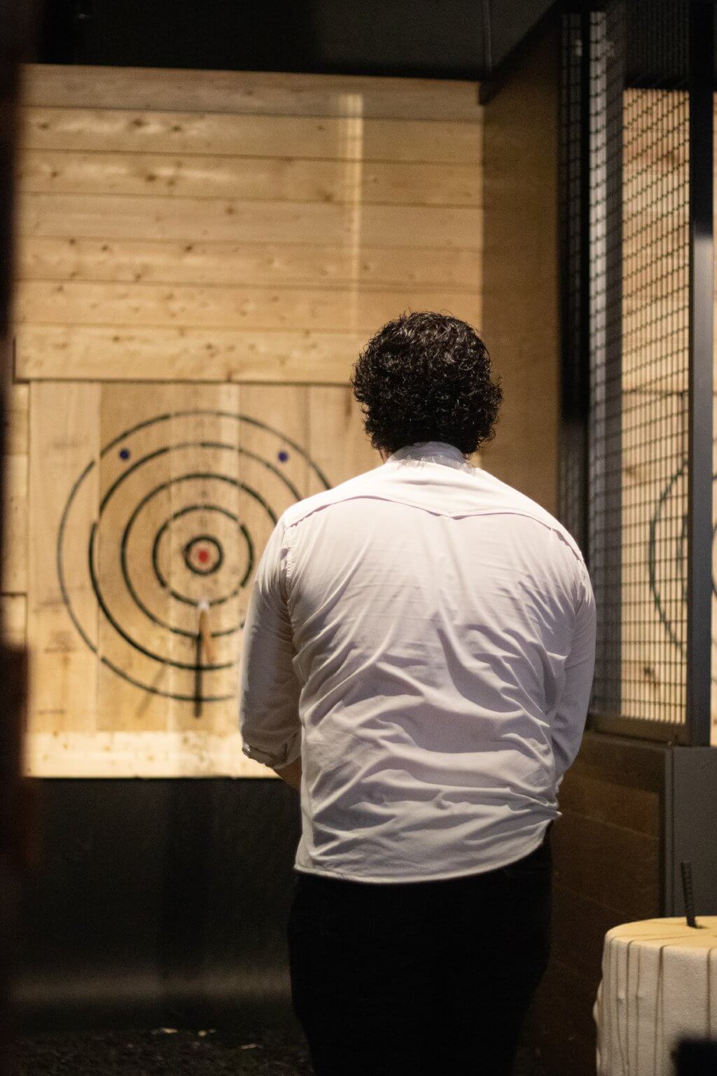 Groom-to-be axe-throwing at his bachelor party
