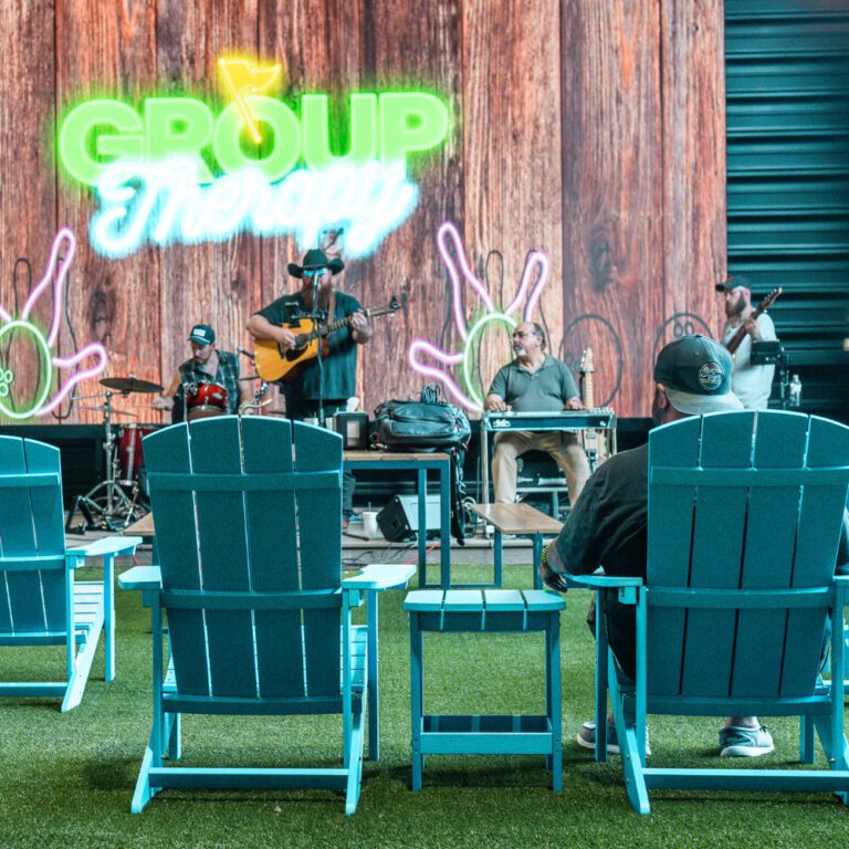 guy in a lawn chair enjoying live music