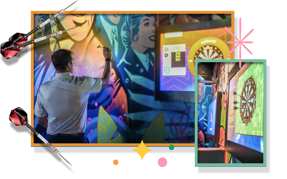 An image showing a person painting a vibrant mural on a wall, with colorful graphics and decor visible in the background, indicating a lively and creative atmosphere.